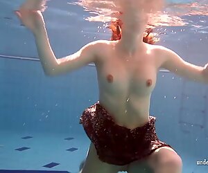 Big tits brunette Mia underwater naked