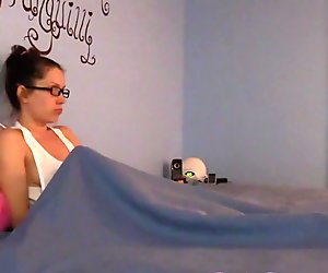 Shy nerdy girl masturbates under the sheets in pajamas