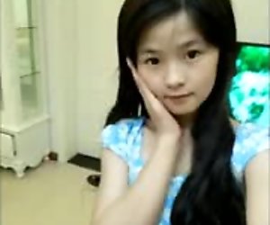 Cute chinese teen dancing on webcam