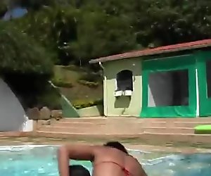 Tasty looking Latin hussies swim in pool in tiny bikini