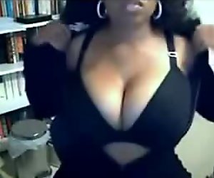 Voluptuous black MILF presents her big boobs